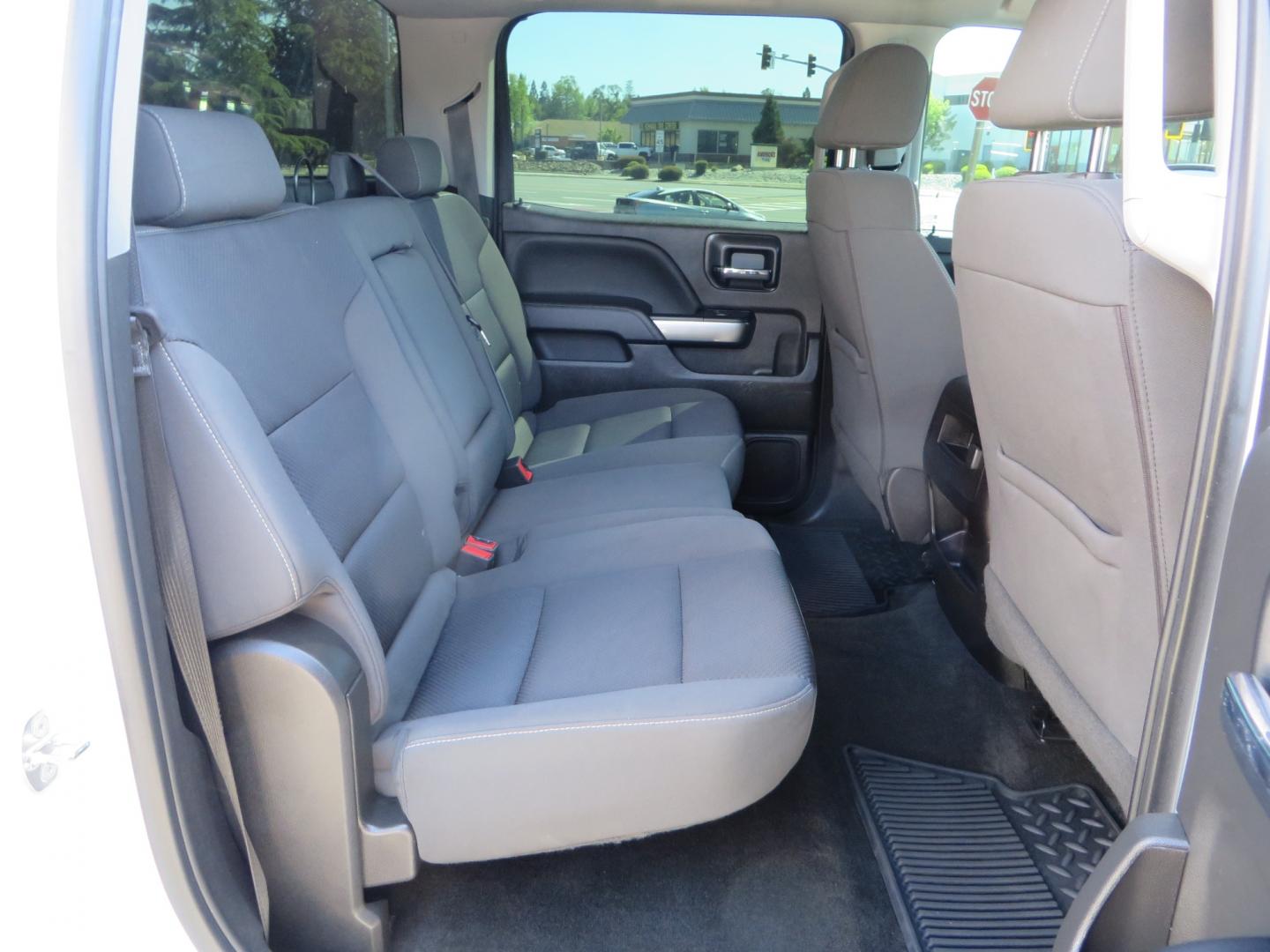 2018 White /BLACK Chevrolet Silverado 1500 LT (3GCPCREC7JG) with an 5.3L V8 OHV 16V engine, automatic transmission, located at 2630 Grass Valley Highway, Auburn, CA, 95603, (530) 508-5100, 38.937893, -121.095482 - Must see Pre Runner.... CST front lift spindals, Camburg UCA's, King Adjustable 2.5 Coil-overs, King 2.5 rear shocks, 35" Toyo RT Trail tires, 17" Method Race wheels, MZ front skid plate, G2 rear differntail cover, Full size bed mounted spare tire, Black Vinyl roof wrap, smoke tail lights and 3rd br - Photo#55